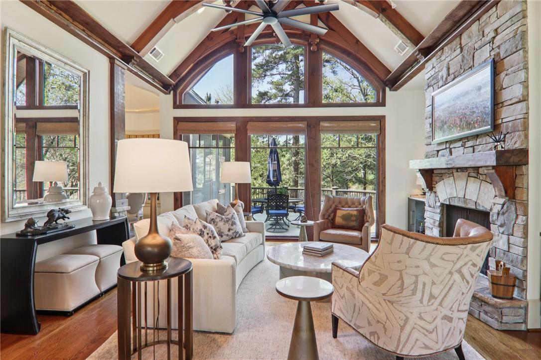 Image 3: This inviting living room showcases vaulted ceilin