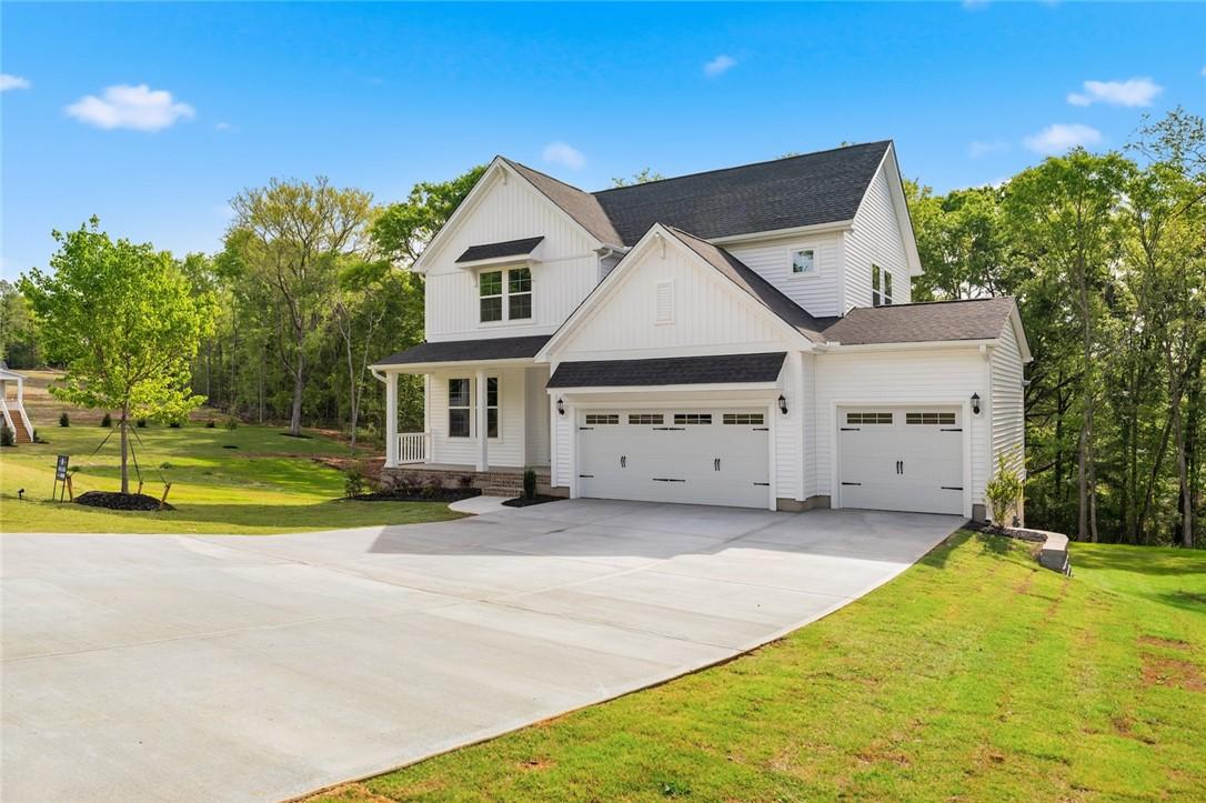 Image 2: This modern farmhouse features a pristine white ex