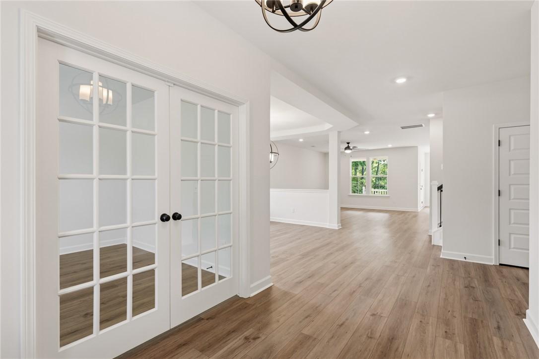Image 4: Enter into a bright, open floor plan with elegant