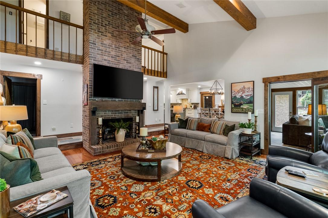 Image 4: Discover a welcoming living room with soaring vaul