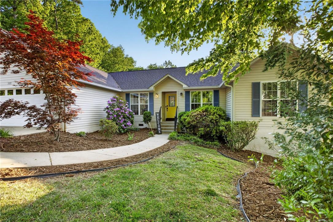 Image 3: A charming exterior with a bright yellow door, inv