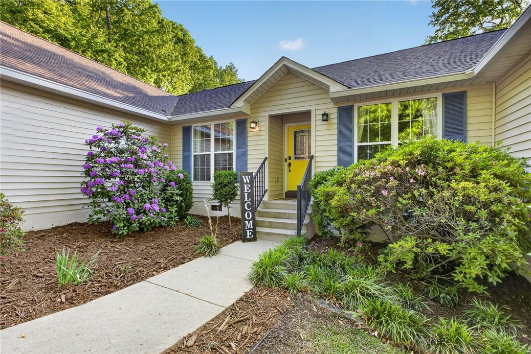Image 4: This charming home offers an inviting entrance wit