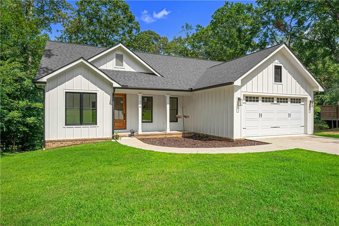 Image 4: A well-maintained lawn welcomes you to this home f