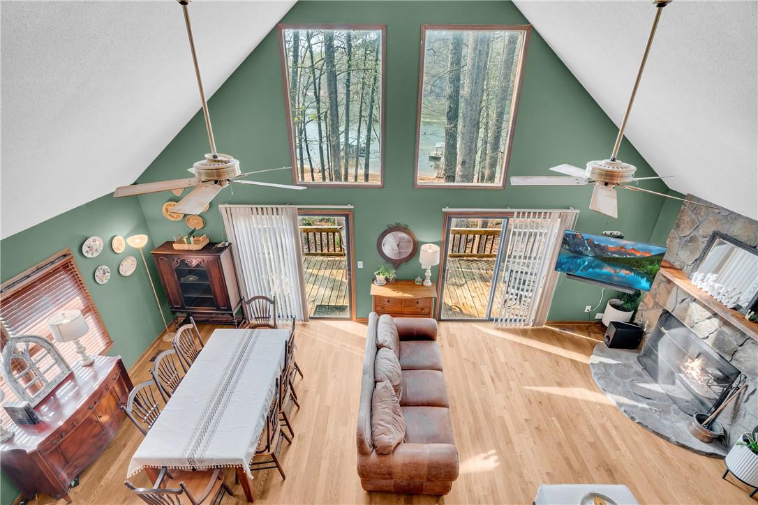 Image 2: This living space offers soaring vaulted ceilings