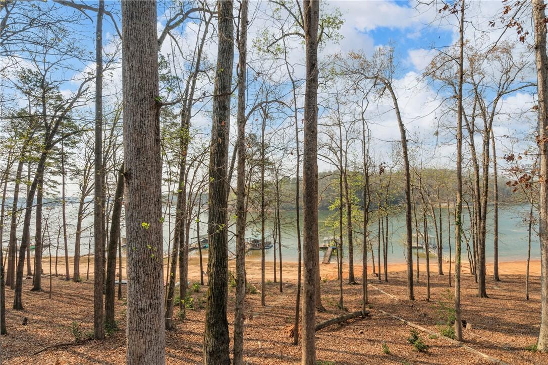 Image 3: Easy walk to the water and your private covered do