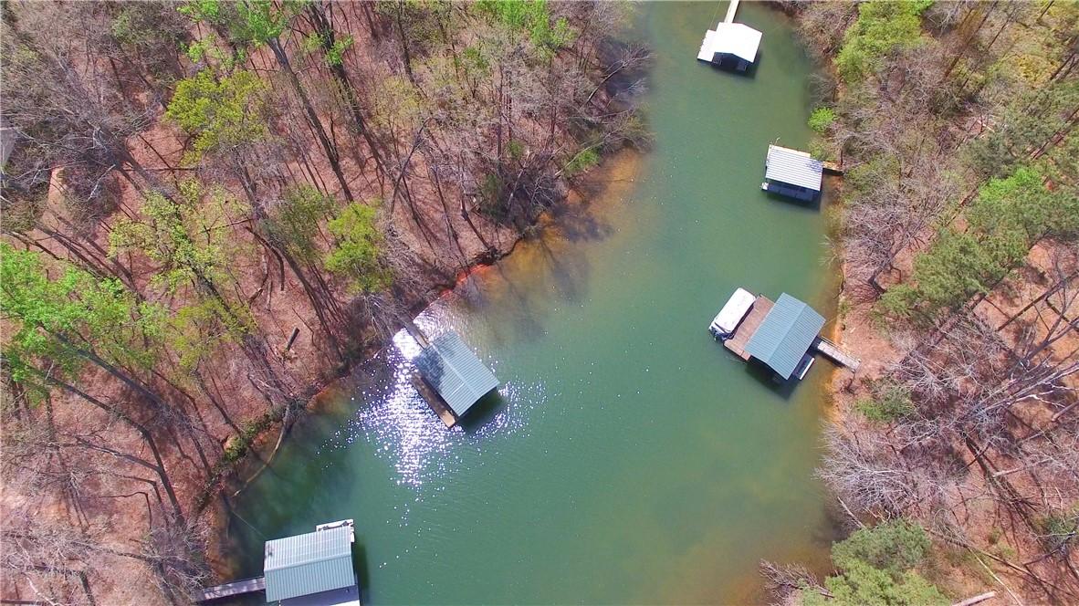 Image 1: This aerial view showcases a serene lake with priv