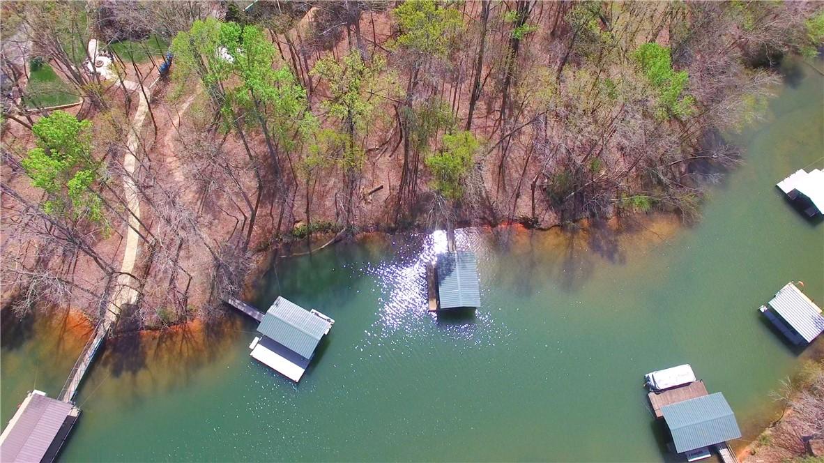 Image 3: This aerial view showcases a serene lakefront prop