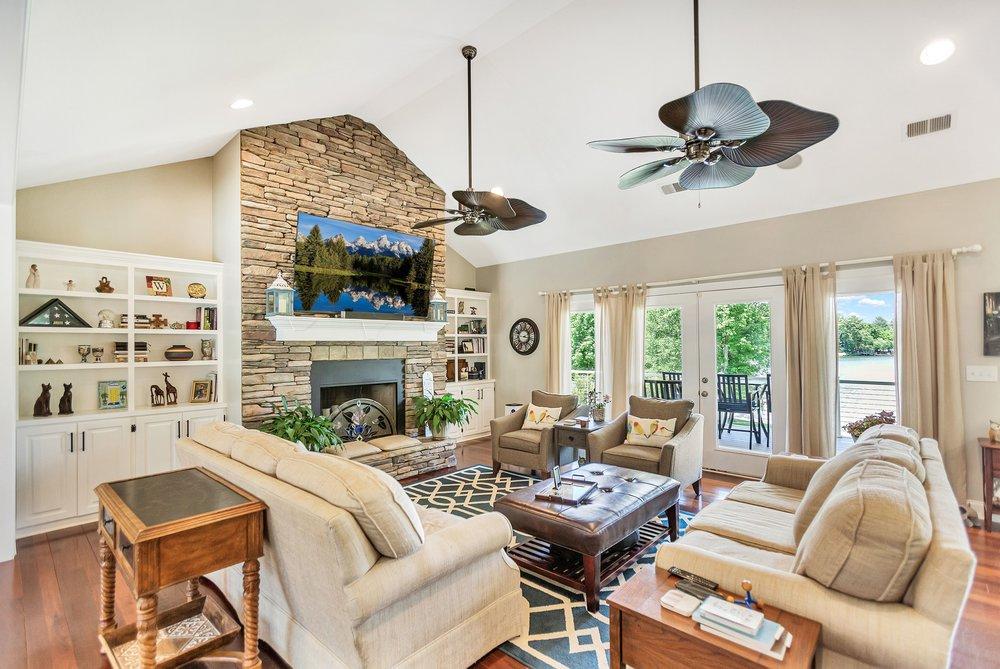 Image 3: This living room features a fireplace and offers s