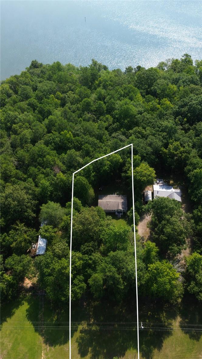 Image 3: A tranquil, tree-lined property offering a private