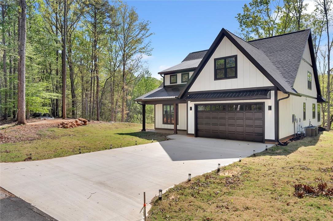 Image 4: This newly constructed home features a crisp white