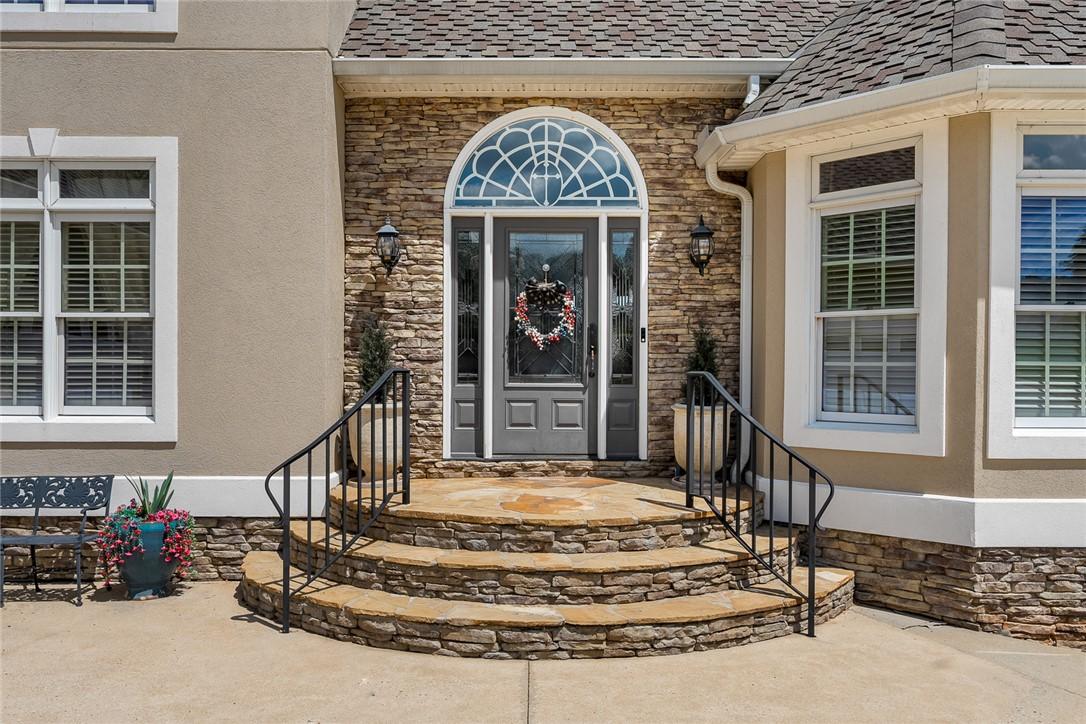 Image 4: A graceful stone stairway leads to an ornate front