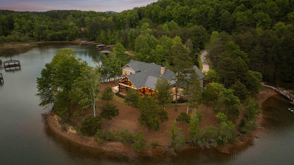Image 4: Perched on a tranquil waterfront, this residence o