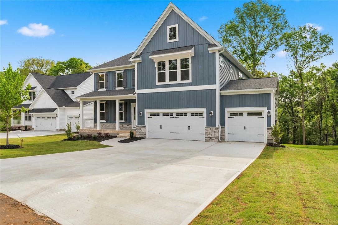 Image 2: This newly constructed home boasts charming curb a