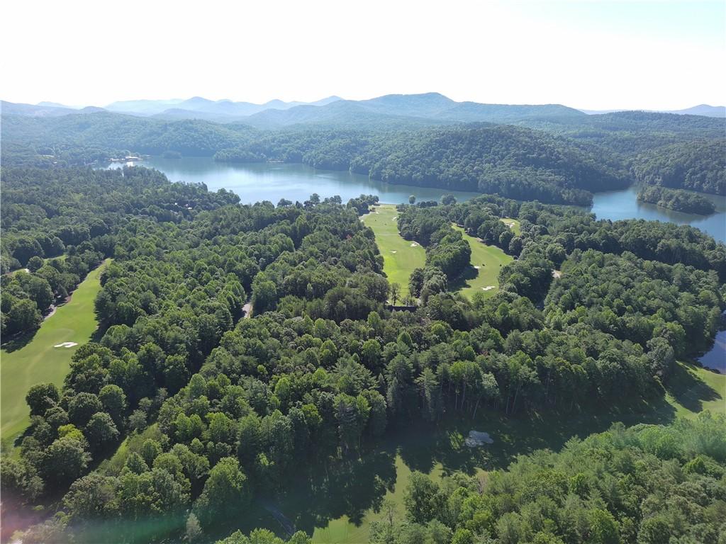 Image 2: Discover a scenic lakefront golf course nestled am