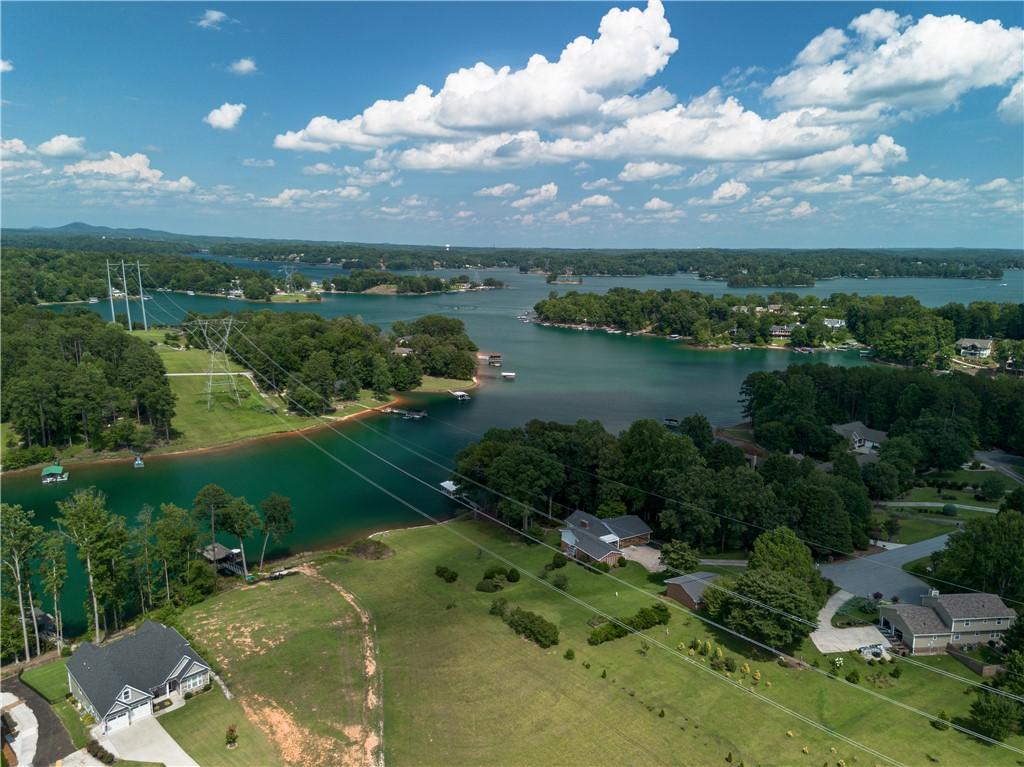 Image 3: Buildable lot across the driveway with boat dock.