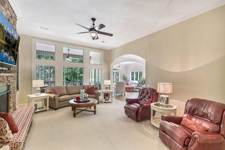 Image 2: This bright living space showcases an inviting atm