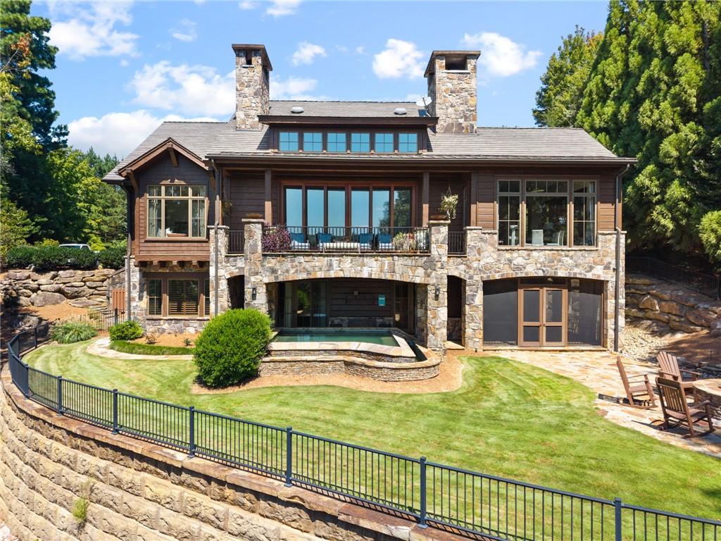 Image 1: Infinity hot tub and park like manicured yard with