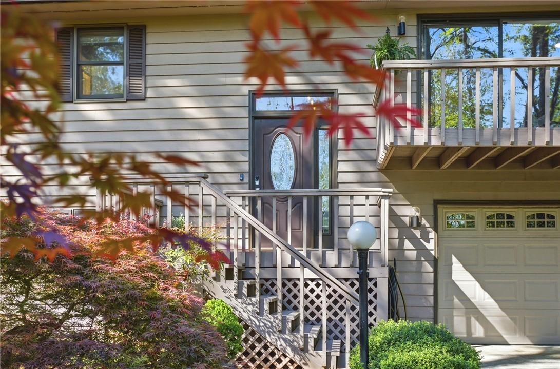 Image 2: This charming home offers a welcoming facade with