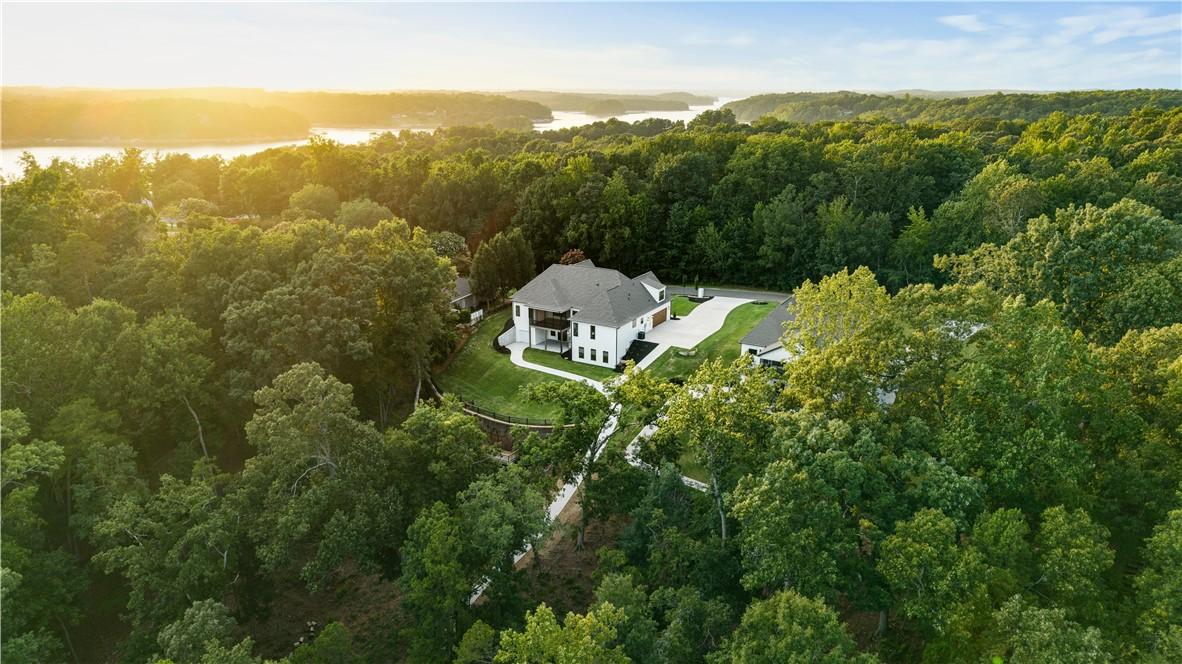 Image 3: An aerial perspective reveals a secluded lakeside