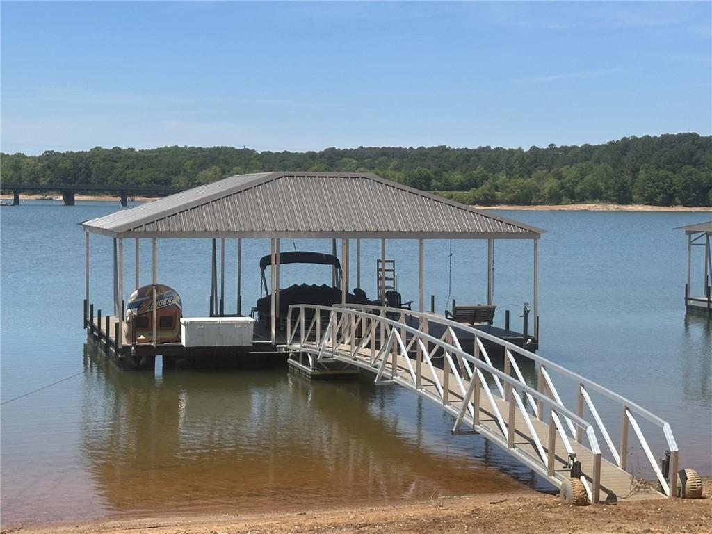 Image 2: This serene lakefront property offers convenient w