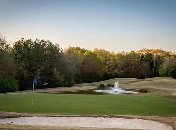 Image 4: This scenic golf course features a putting green,