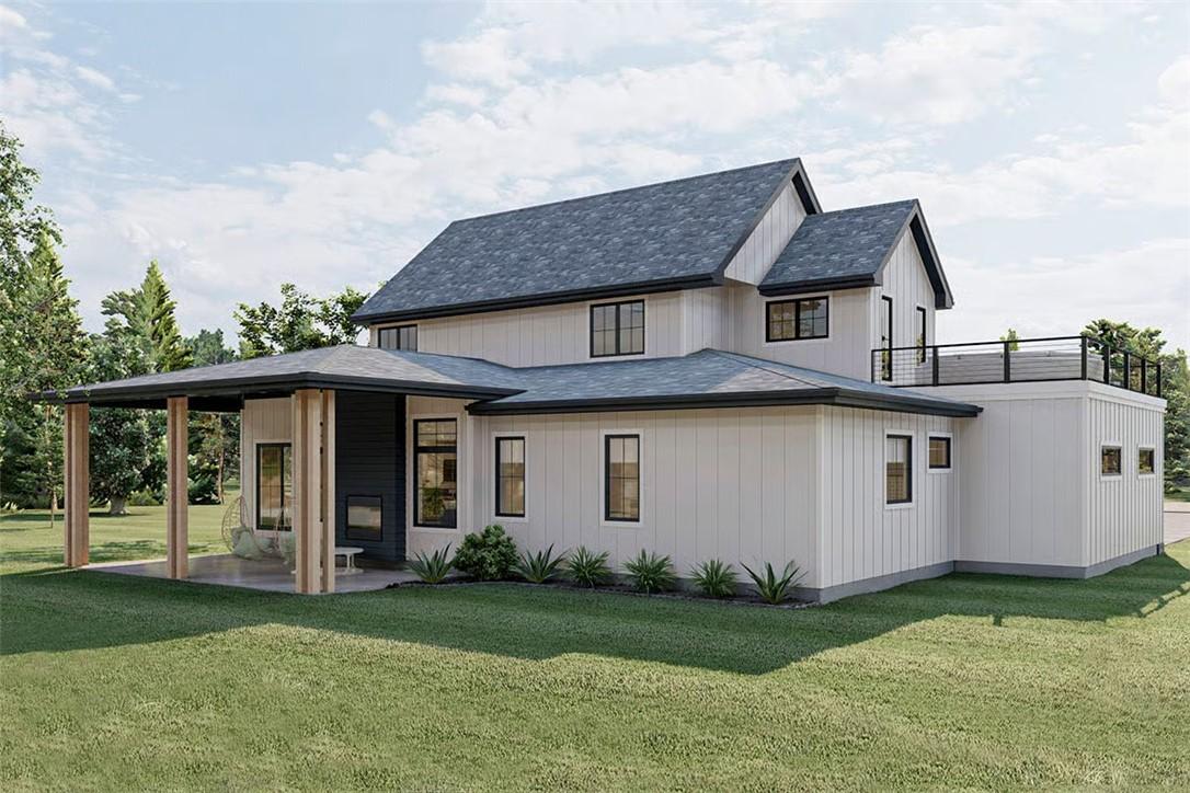 Image 3: This modern home features a spacious covered patio