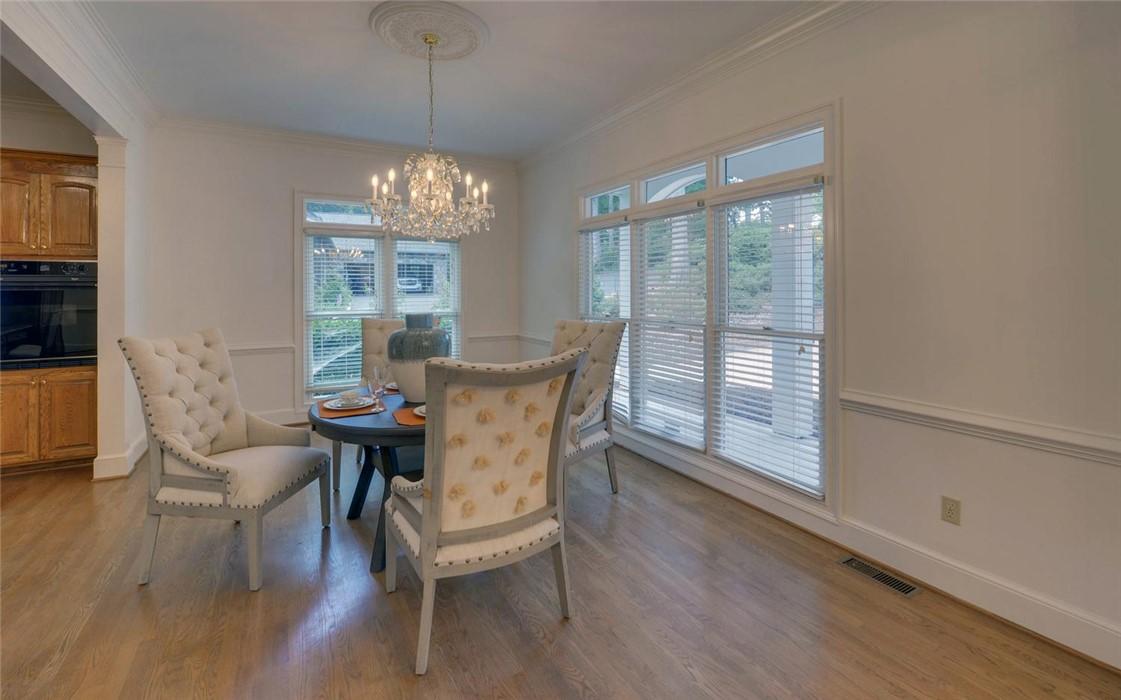 Image 4: A classic chandelier illuminates the elegant dinin