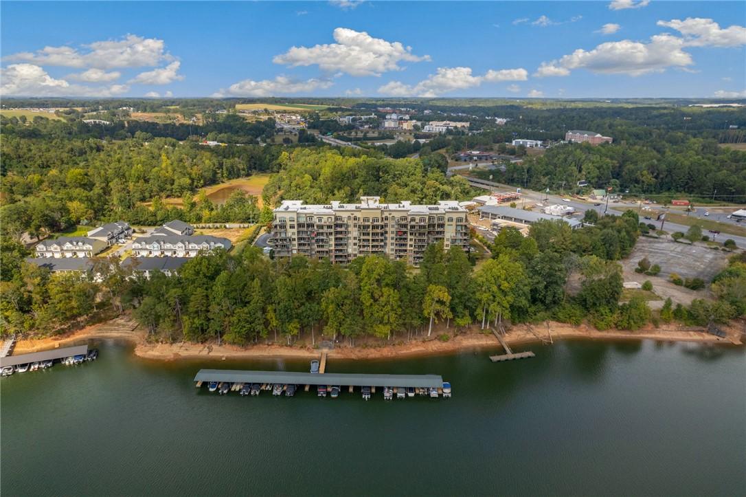 Image 1: Perched above the water, this multi-story building