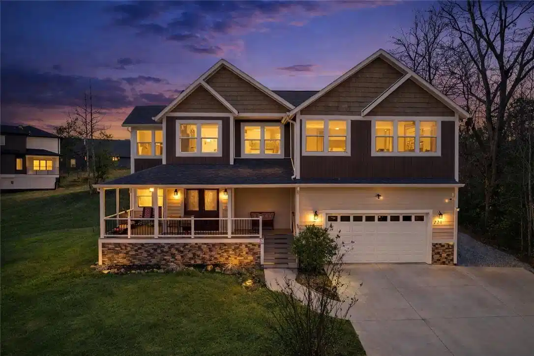 Image 1: This charming home offers a welcoming facade with