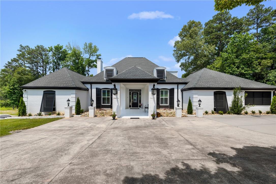Image 3: The property welcomes you with a concrete upper dr