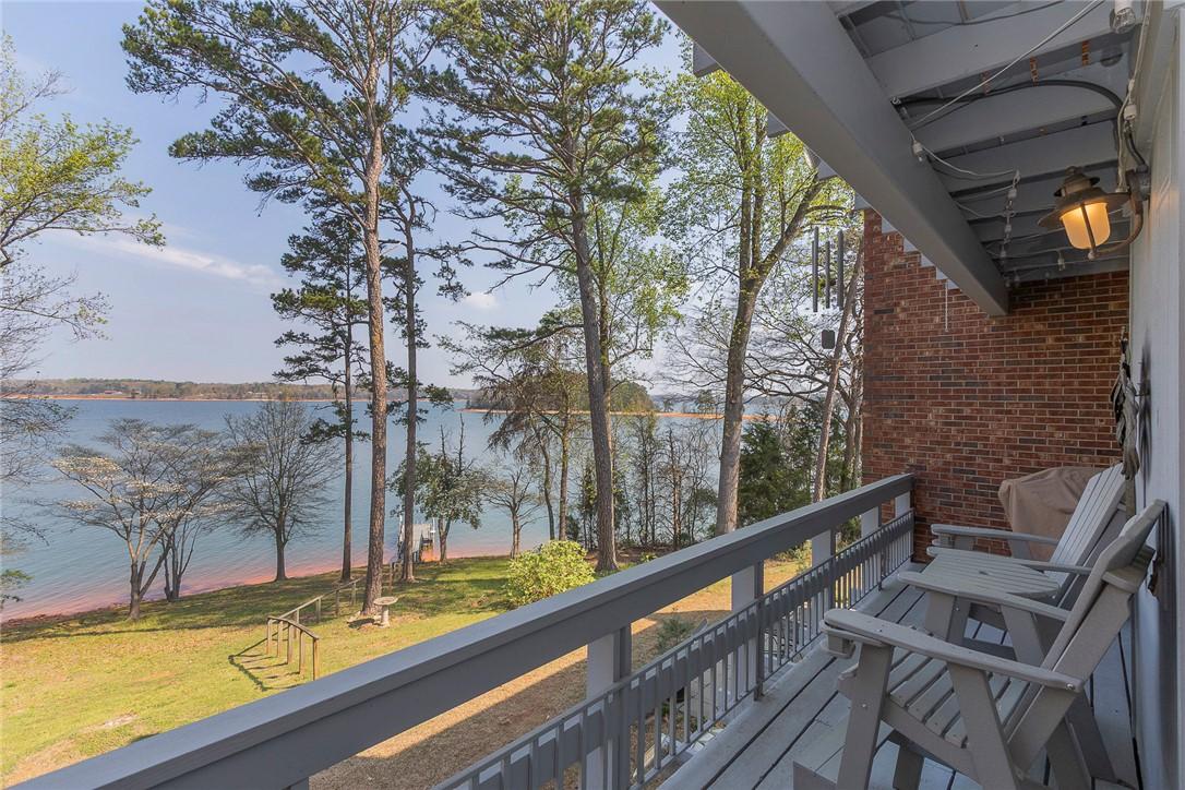 Image 1: Enjoy tranquil water views from this expansive dec