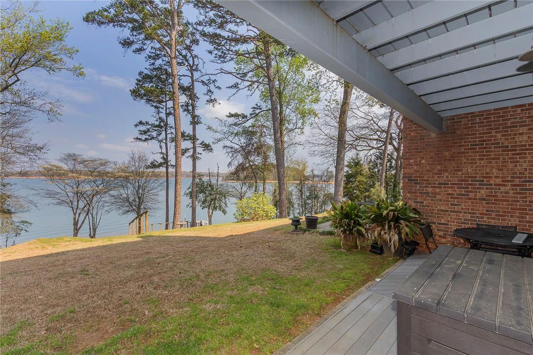 Image 3: This serene lakeside property offers tranquil view
