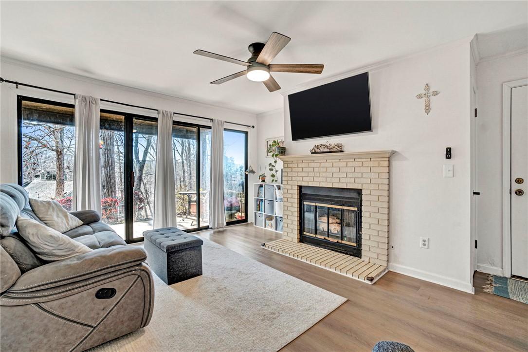 Image 4: This inviting living space features a cozy firepla