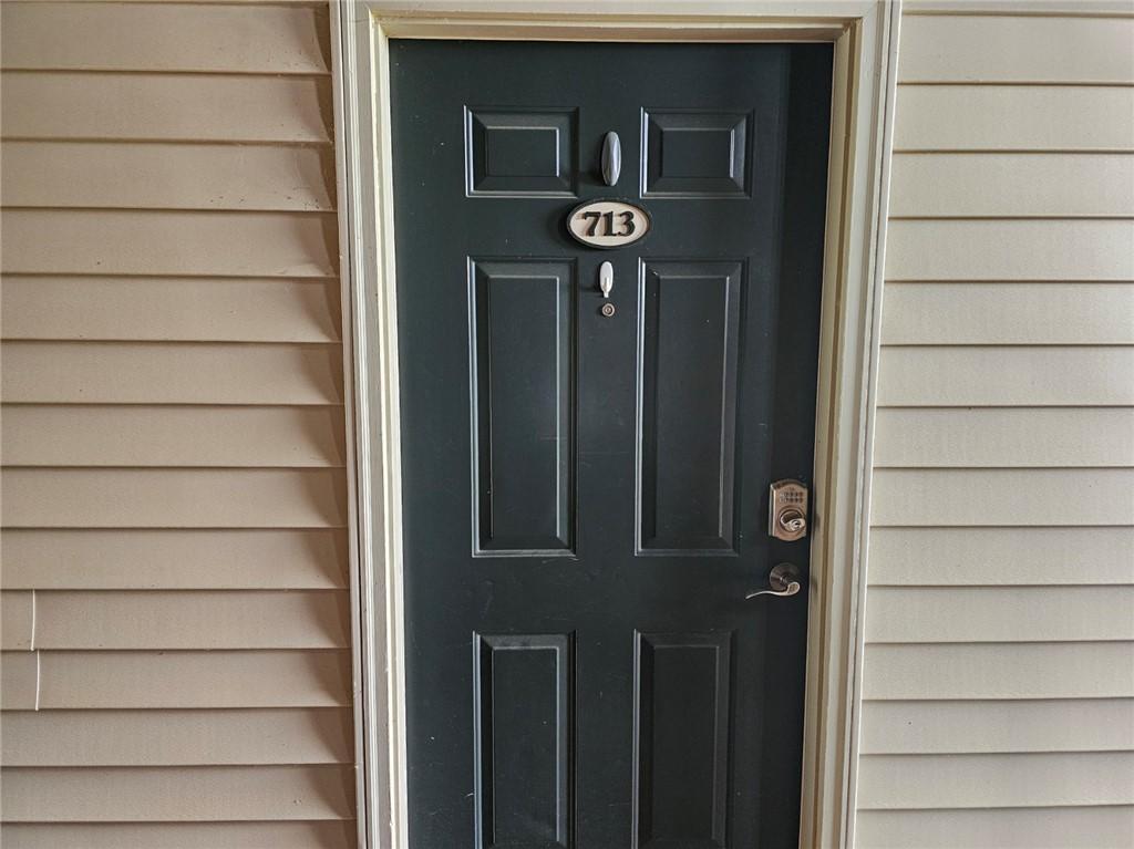 Image 2: This entry door with a smart lock offers convenien
