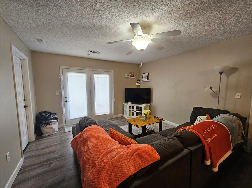 Image 3: This inviting living area features durable floorin