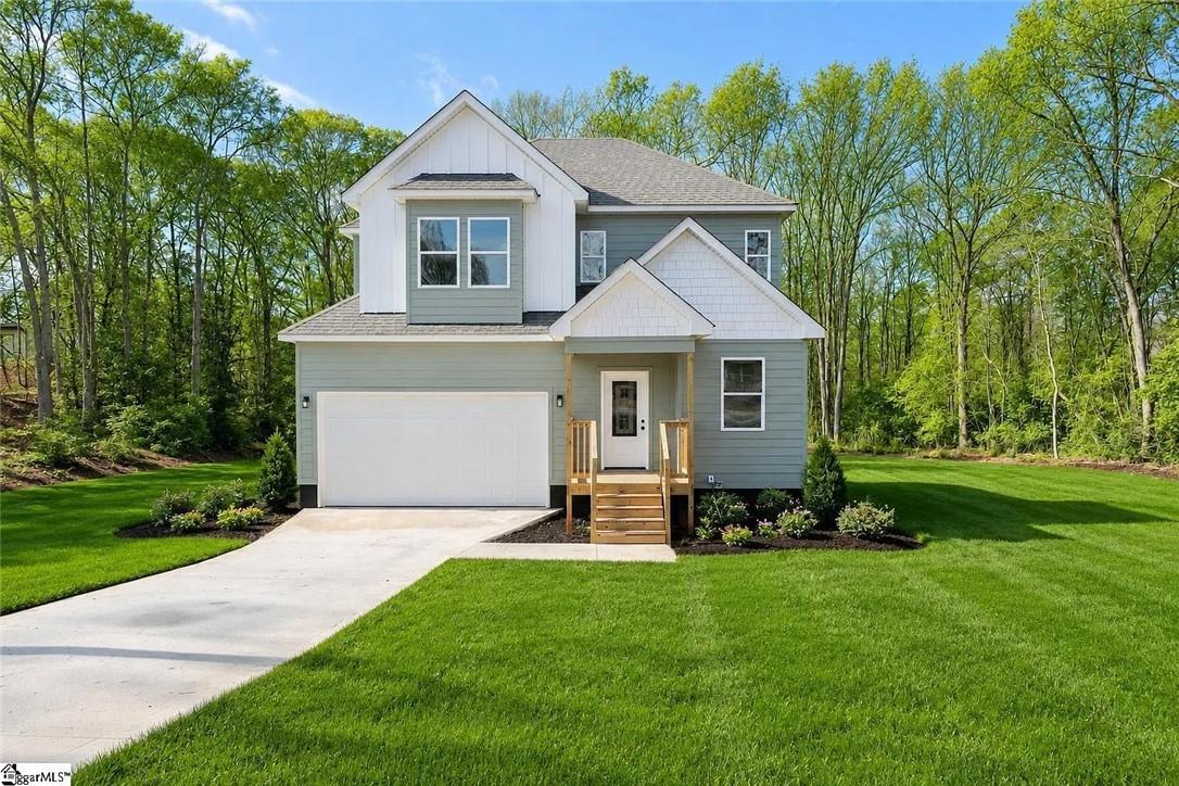 Image 1: A newly built residence with a welcoming porch and