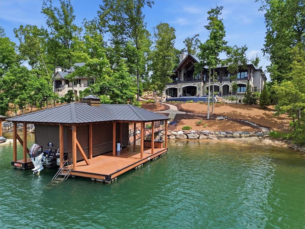 Image 2: A private boat dock and luxurious waterfront home