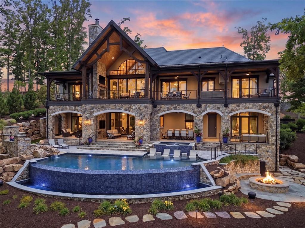 Image 3: A grand multi-level residence features an infinity