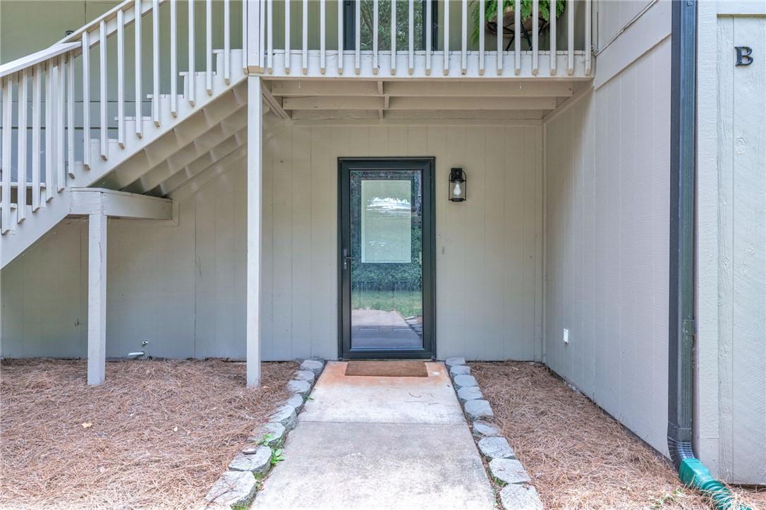 Image 3: A welcoming entry invites with a classic glass sto