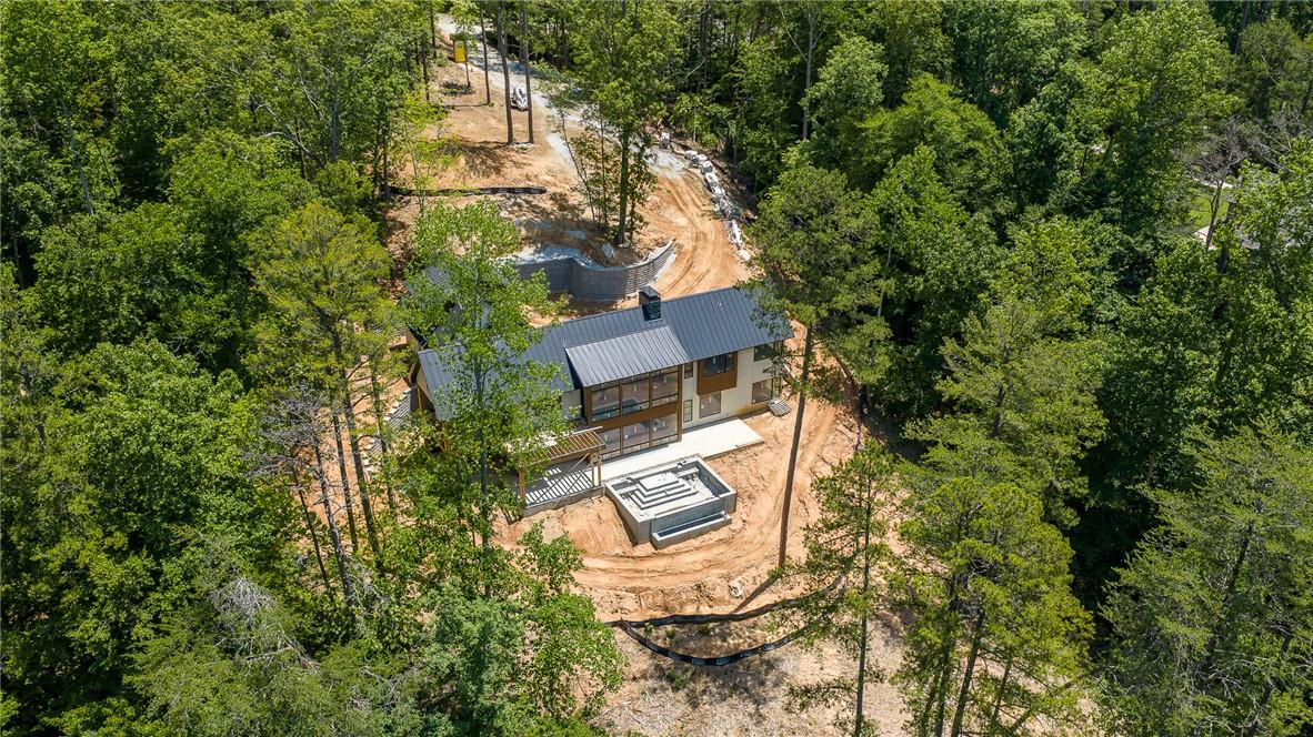 Image 2: Nestled amidst lush woodlands, this contemporary r
