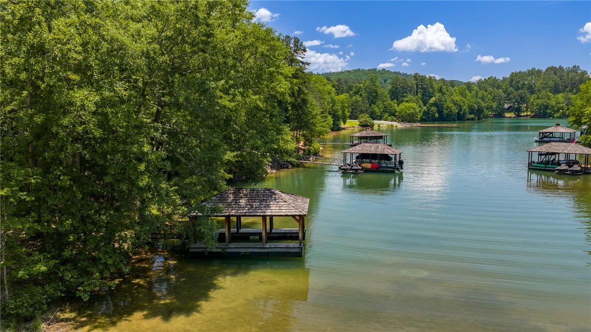 Image 4: A tranquil lake view just steps from walk-out base