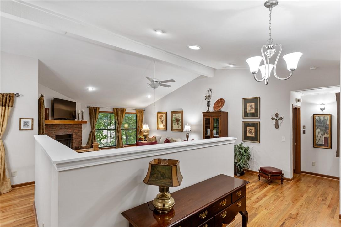 Image 3: Natural light pours into this living space, featur