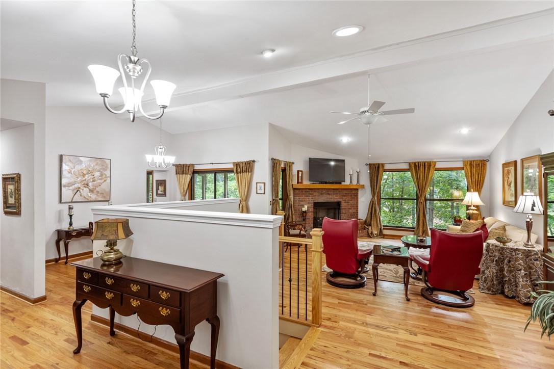 Image 4: Hardwood flooring extends throughout this generous