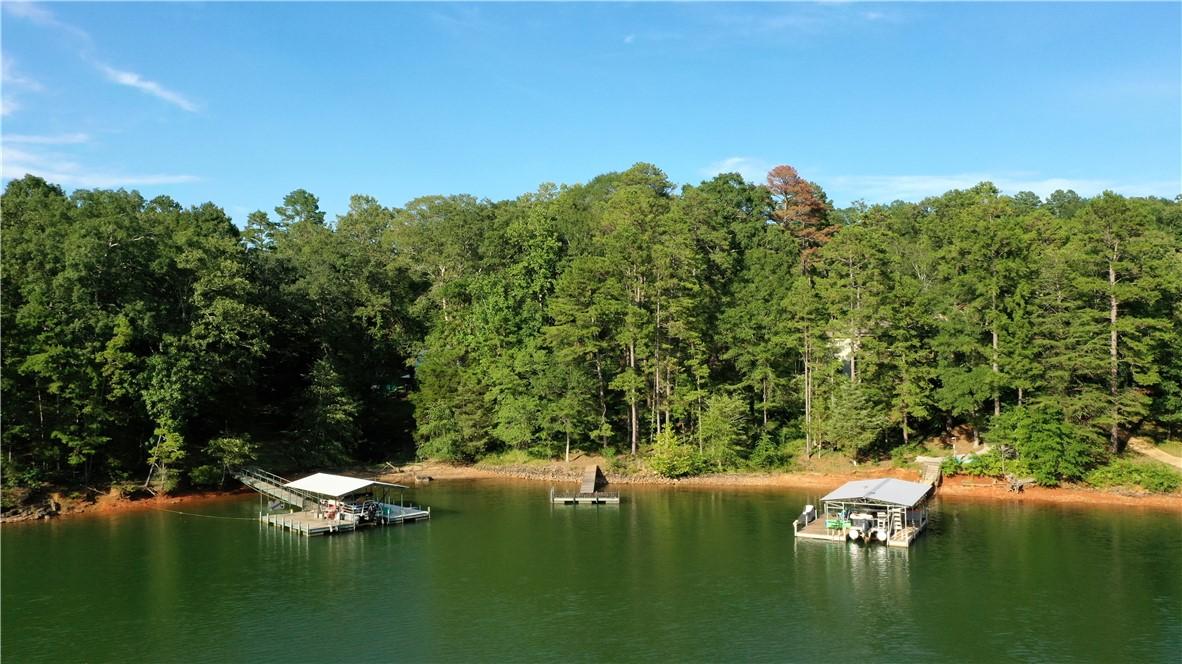 Image 2: A tranquil lakefront property featuring private do