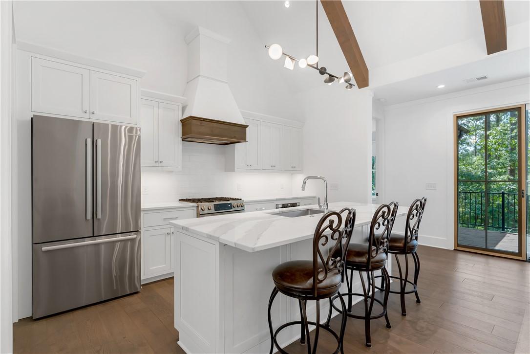 Image 3: Kitchen with gas range.
