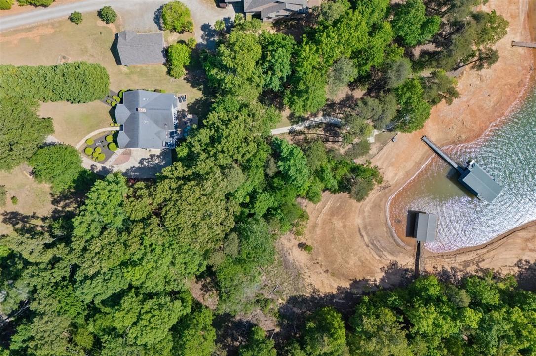 Image 1: This aerial view showcases a captivating property