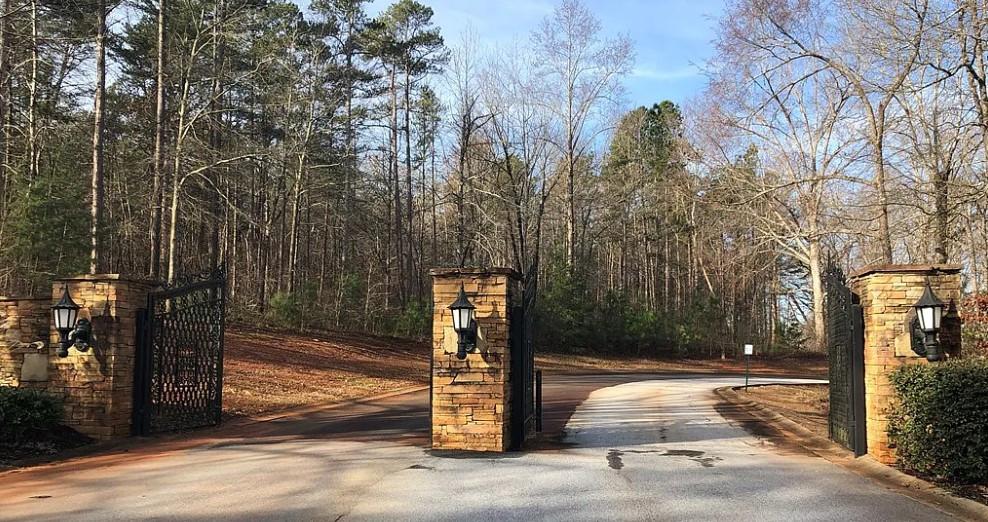 Image 4: Enter a private, tree-lined drive through stately