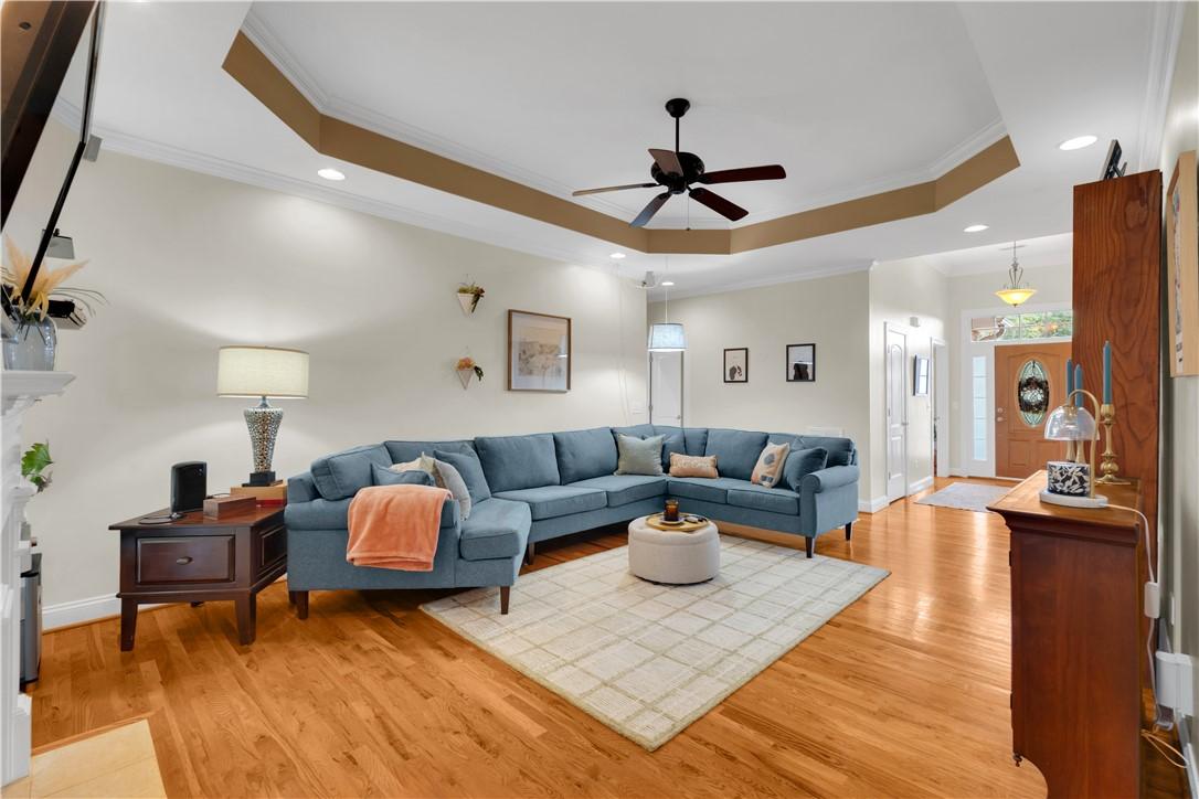 Image 4: A warm and inviting living area features gleaming