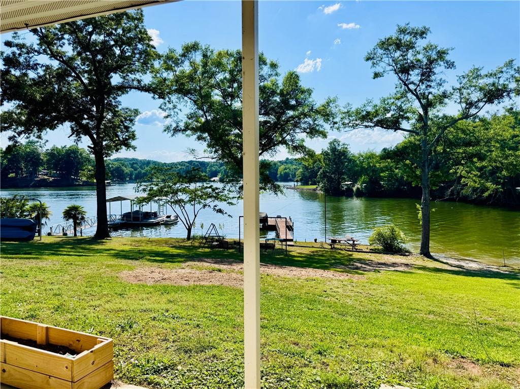 Image 2: Embrace serene waterfront living with a private do
