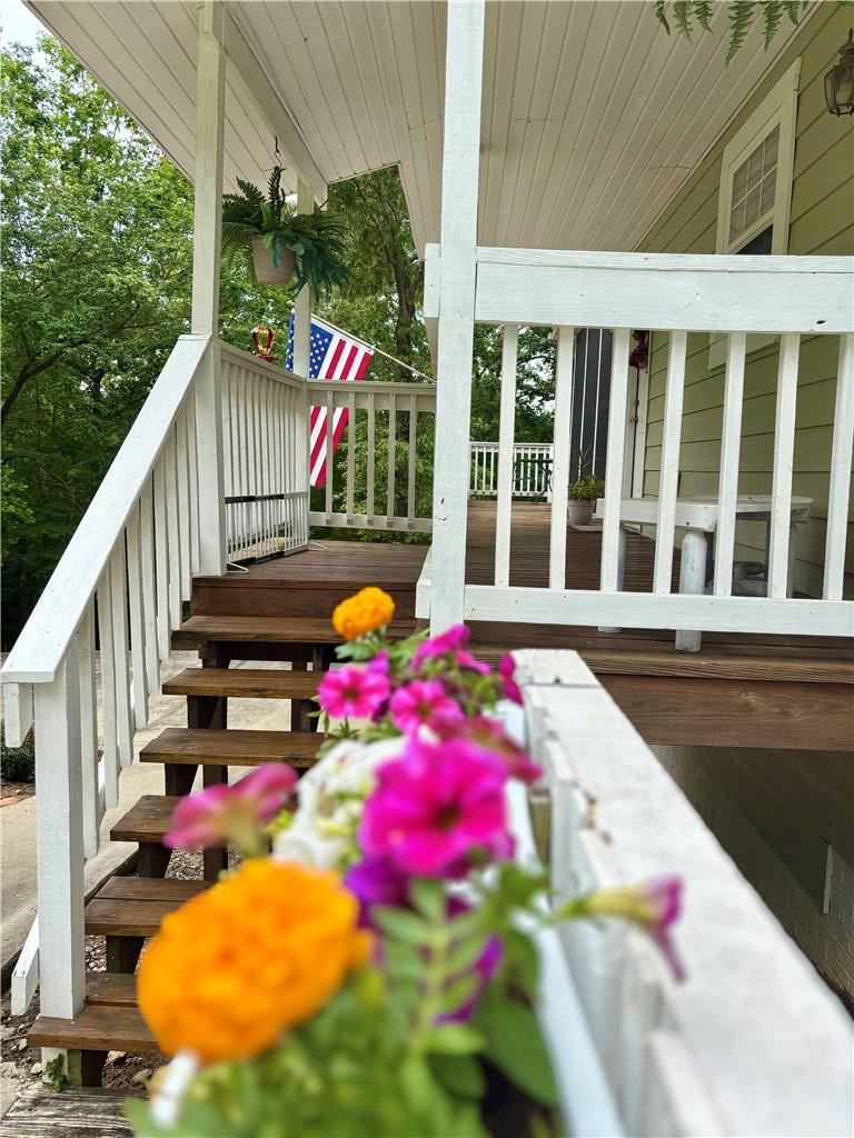 Image 2: An inviting front porch with sturdy wooden steps,